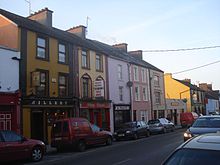 Colorful shops in Main Street Milltown Malbay.jpg