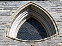 Reuleaux triangle shaped window of Onze-Lieve-Vrouwekerk, Bruges.jpg