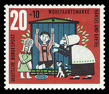 Postage stamp showing Hansel imprisoned in a cage with the evil stepmother and Gretal standing outside.