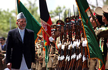 220px Hamid Karzai at Kabul Military Training Center in 2002