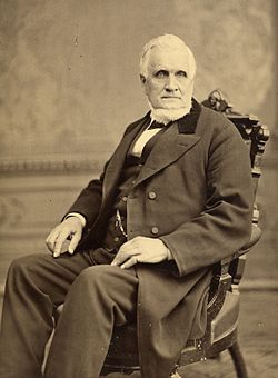 John Taylor seated in chair.jpg