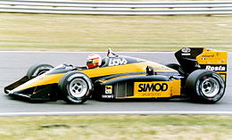 Адриан Кампос за рулём Minardi M187 на Гран-при Великобритании 1987 года